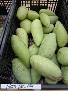 Nam Doc Mai mangoes in market crate