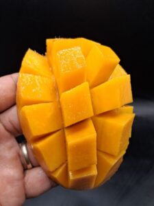 Rosigold mango cut open showing deep orange flesh - Rosigold mango