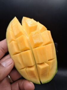 Lemon Zest mango cut open showing yellow-orange flesh